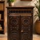 Small antique side table in carved wood.