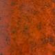 Vintage bistro table with orange-red ceramic.