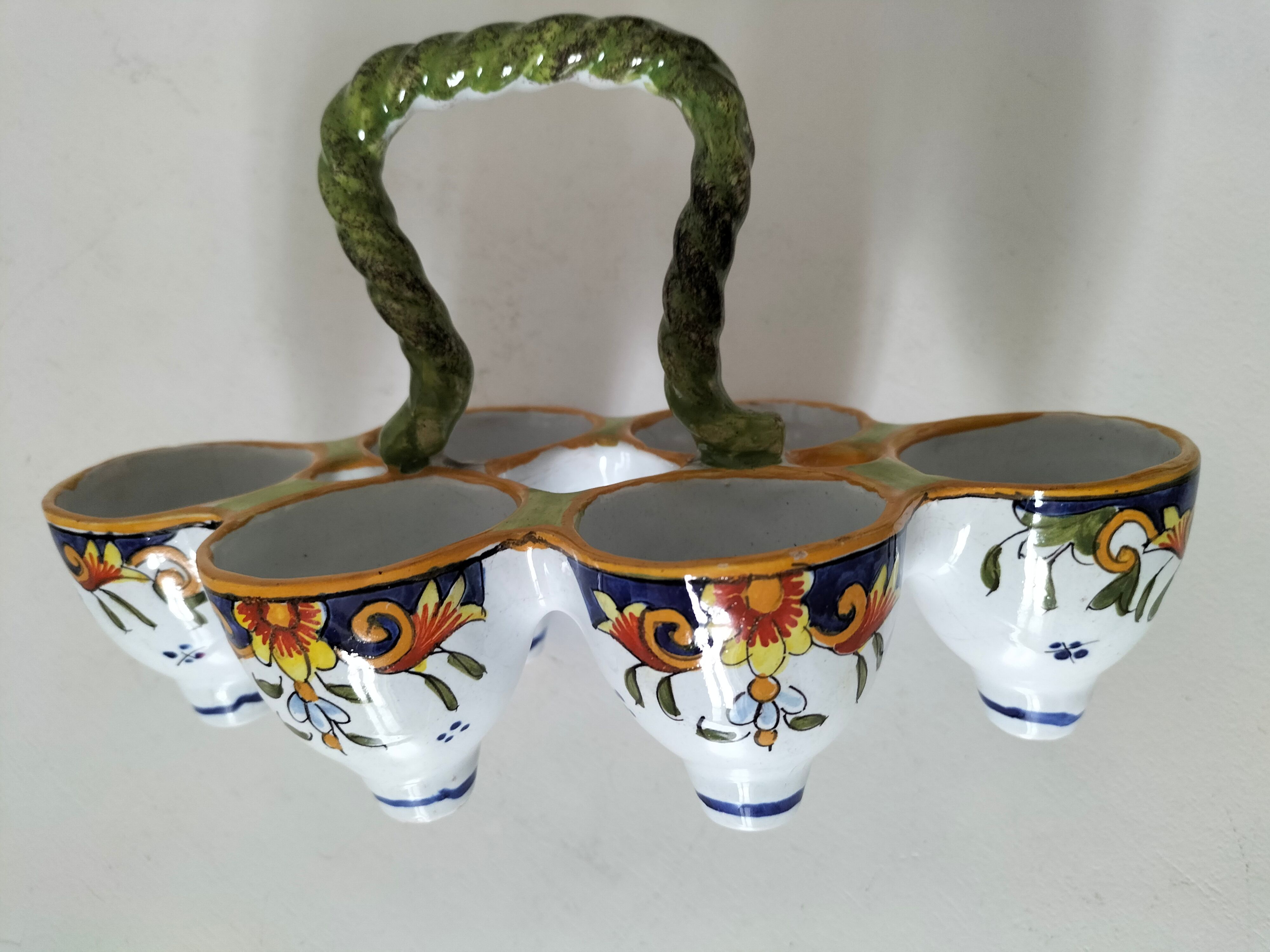 Antique egg holder by Jules Verlingue with polychrome floral decoration.