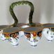 Antique egg holder by Jules Verlingue with polychrome floral decoration.