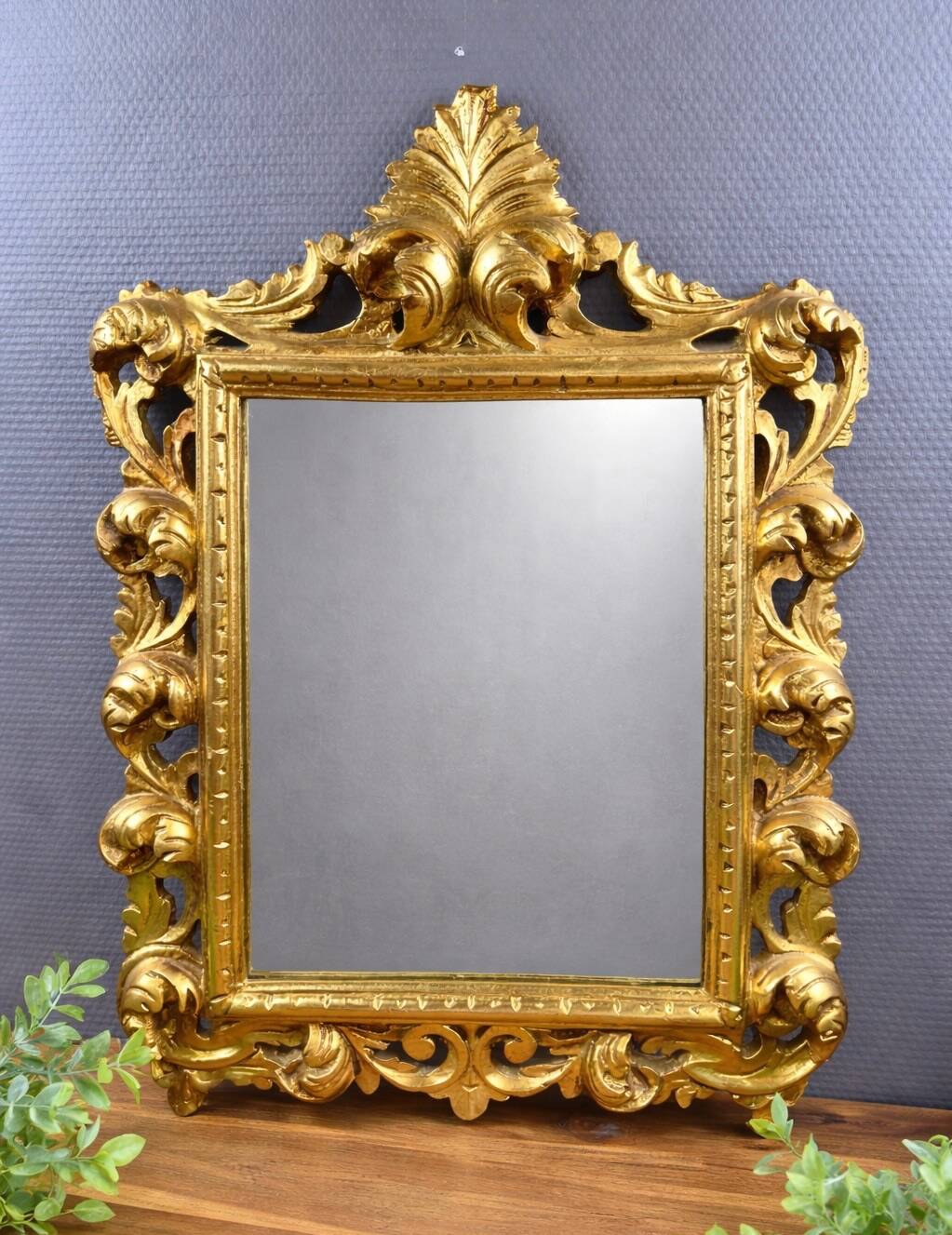 Antique Louis XV style mirror in gilded carved wood.