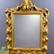 Miroir ancien style Louis XV en bois sculpté doré