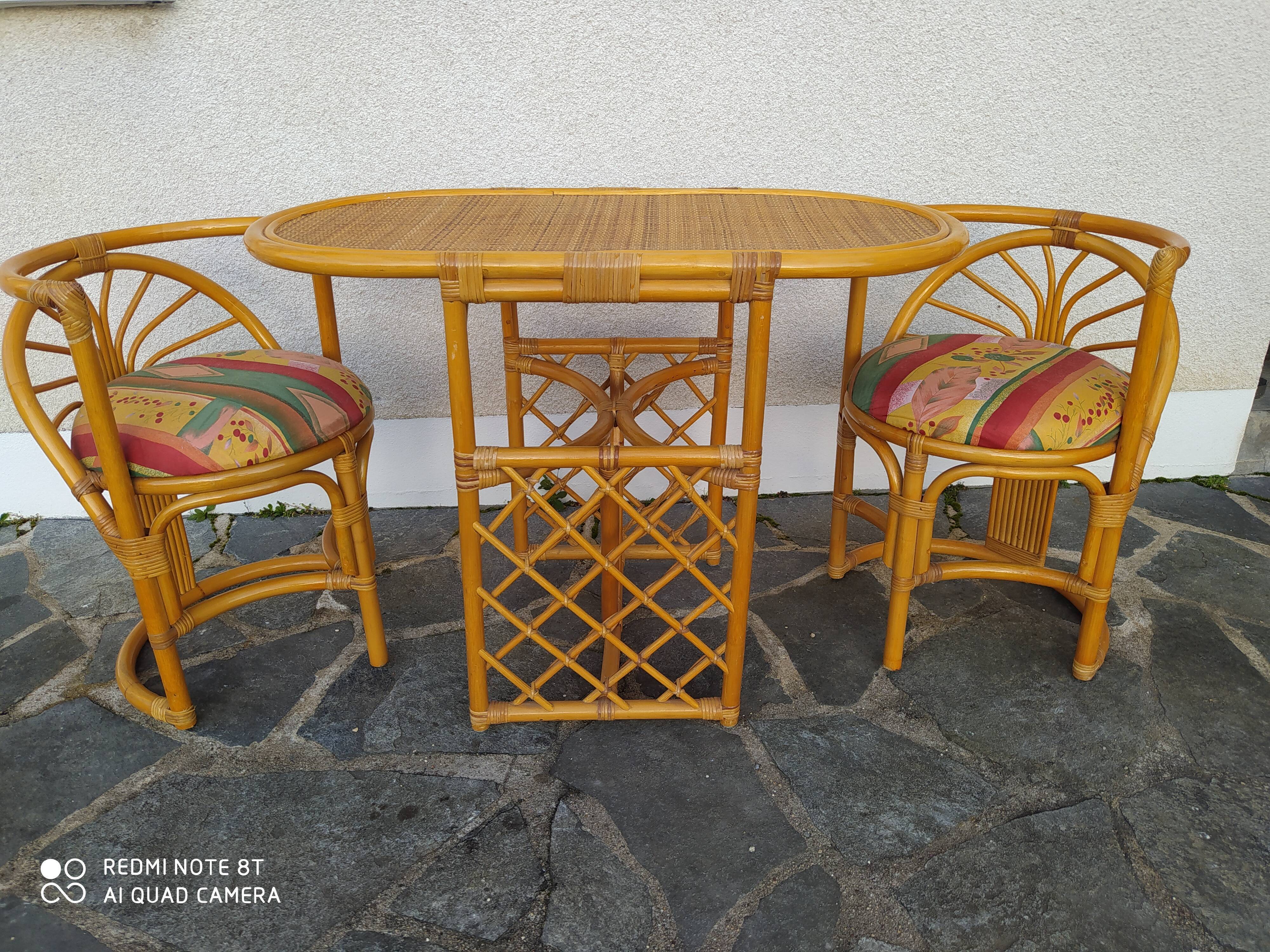 Vintage rattan tête-à-tête table with 2 armchairs