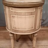 Round bedside table painted in trompe l'oeil
