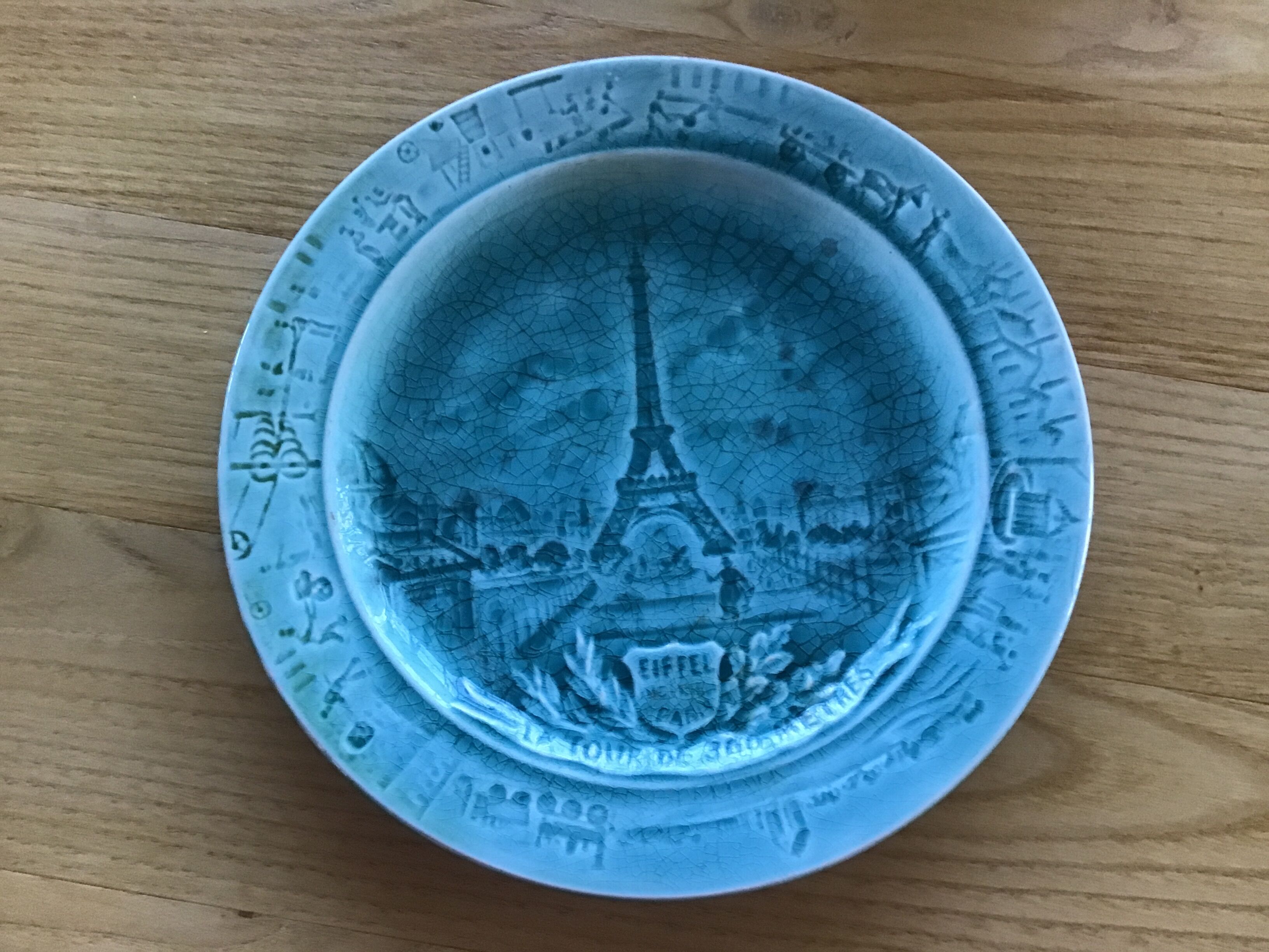 Cracked earthenware plate the Eiffel Tower