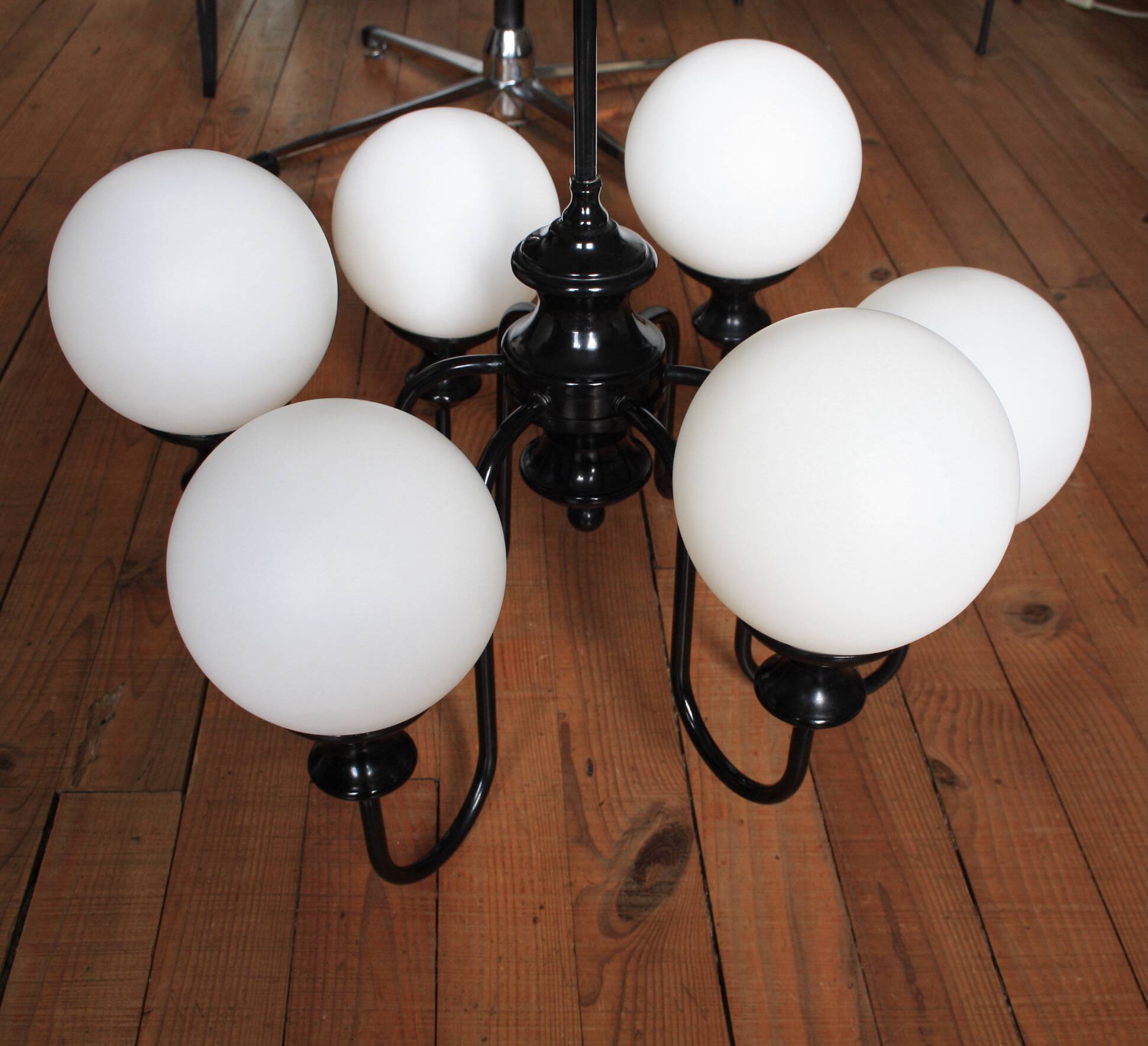 Metal chandelier and glass globes