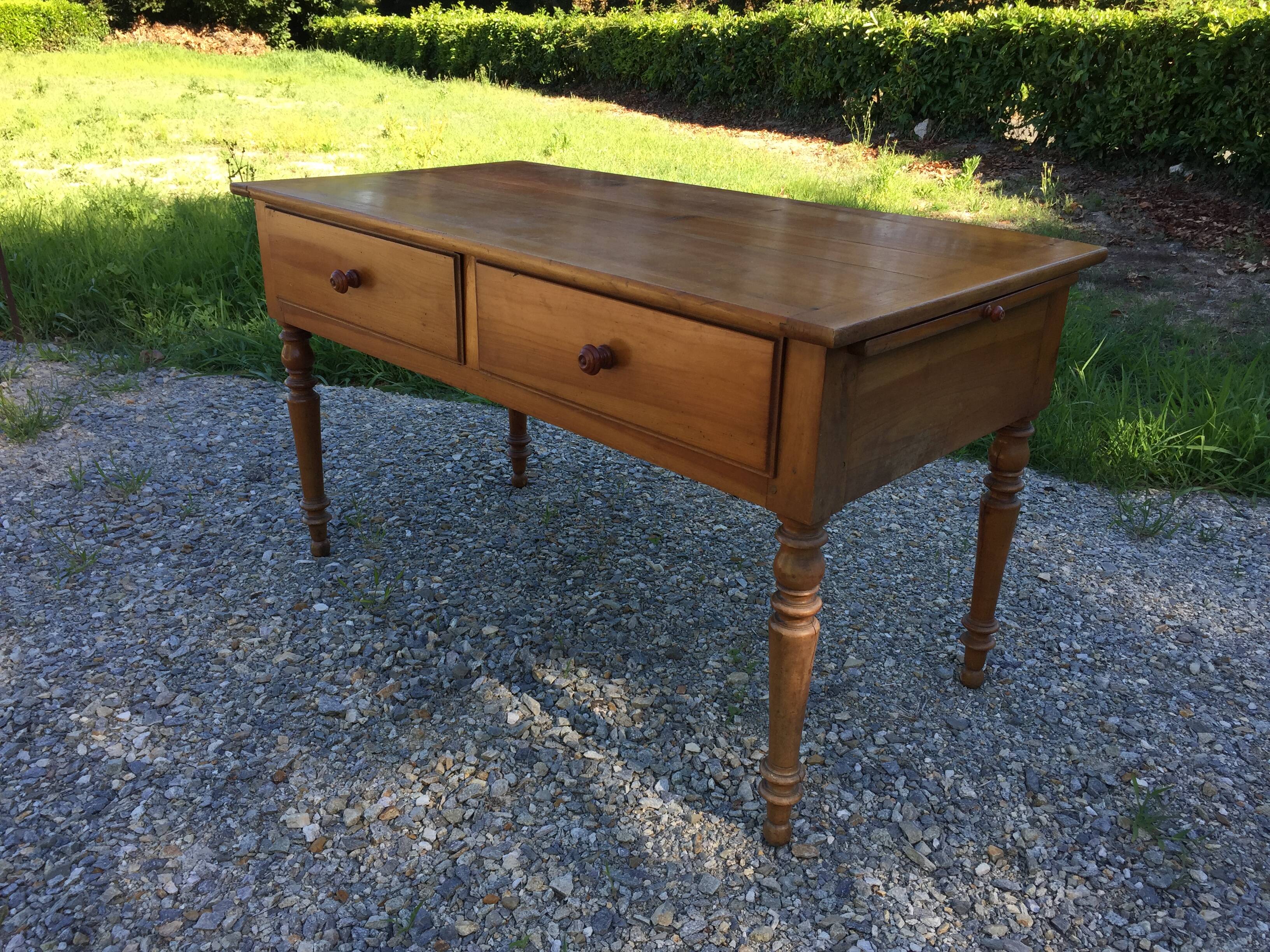 Old farmhouse table louis Philippe style in solid cherry with turned feet.