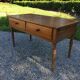 Old farmhouse table louis Philippe style in solid cherry with turned feet.