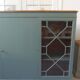 English sideboard, shallow, smoky green, wooden top.