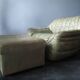 Laauser lounge chair and ottoman in olive green patchwork leather, 1970s