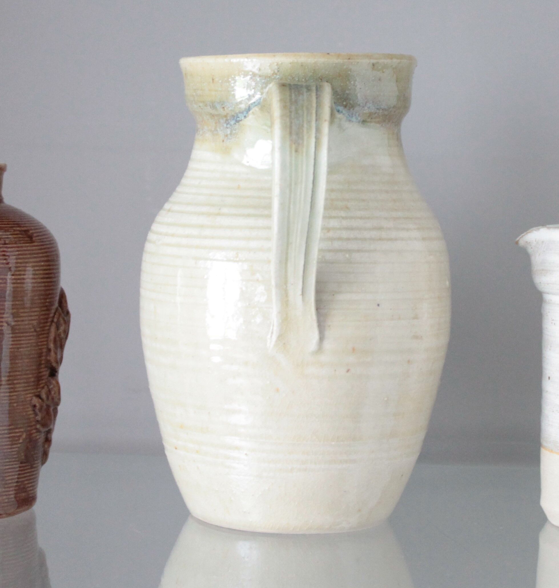 Old decanter in enamelled sandstone