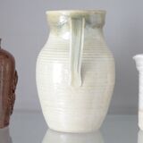 Old decanter in enamelled sandstone