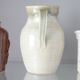 Old decanter in enamelled sandstone