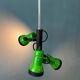 Vintage pendant light with three green spots.
