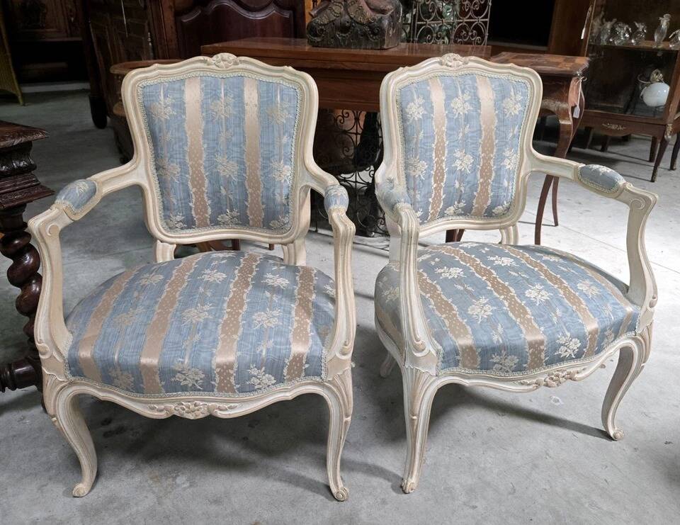 Pair of Louis XV style armchairs, in moulded and patinated wood.
