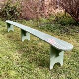 Old curved wooden farm bench