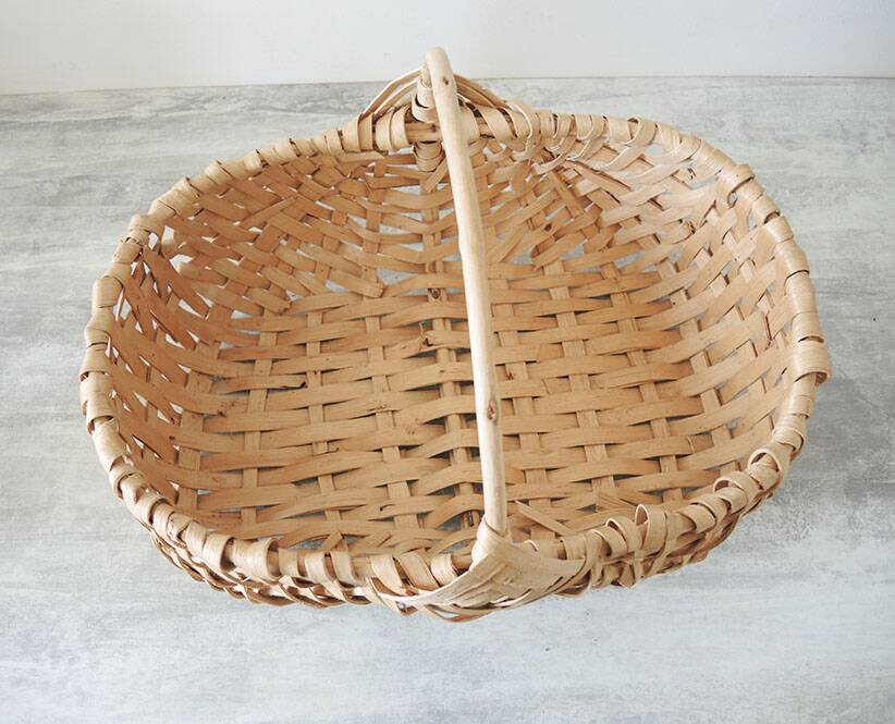 Old wicker basket / woven light leaves
