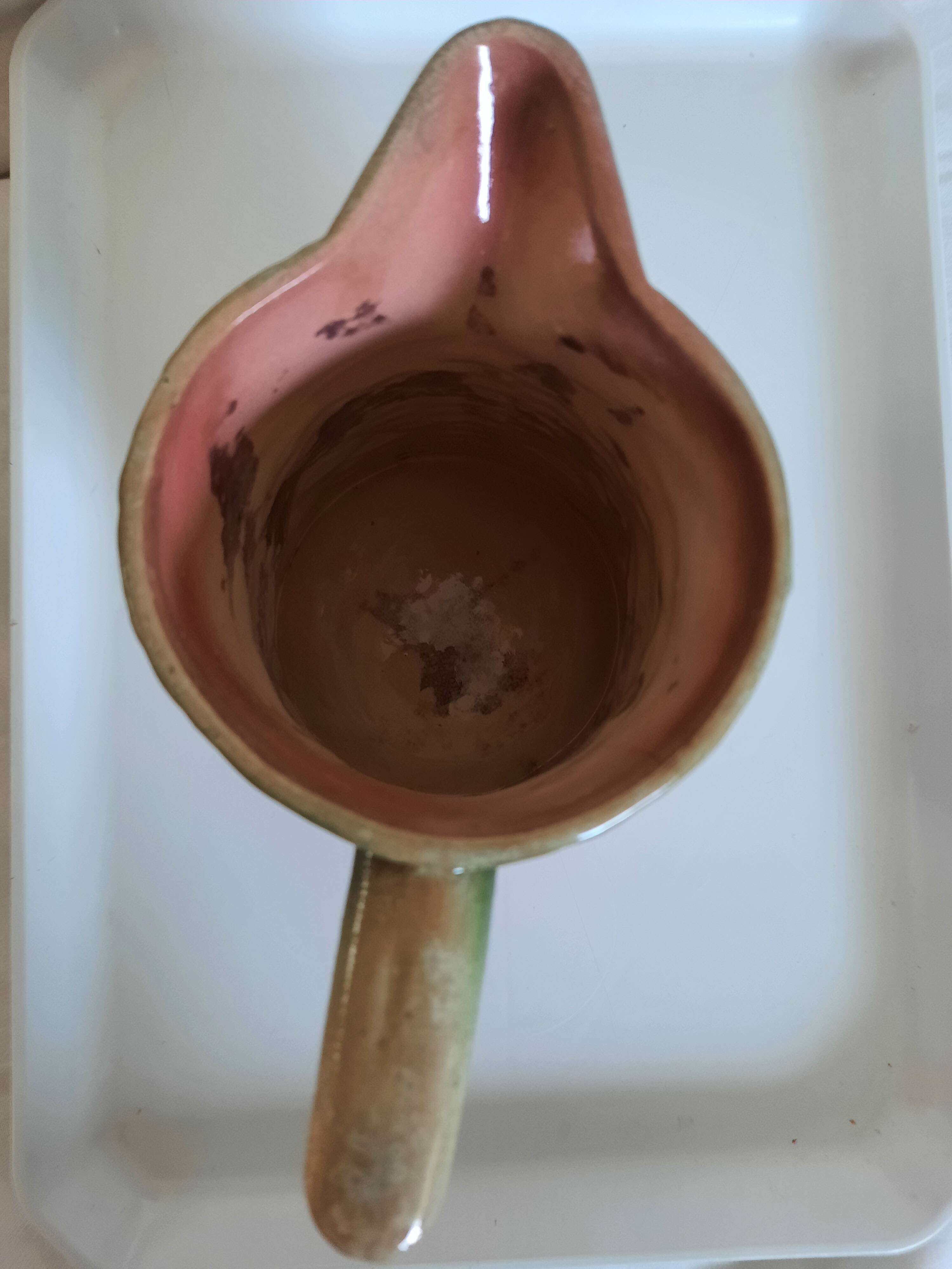 Slush pitcher. Pansy pattern on wicker basket background. Green and pink.