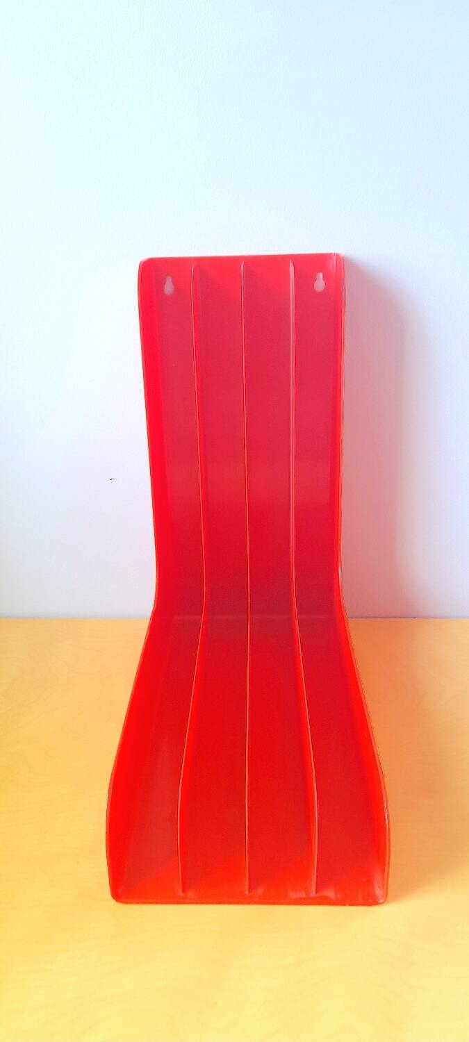33 rpm vinyl record rack, in orange 70s plastic.