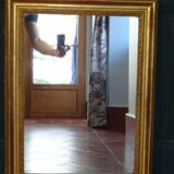 Empire period mirror, early nineteenth in gilded stucco wood H 72 cm