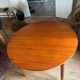 Scandinavian round teak table with butterfly extensions from the 60s