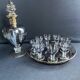 Complete shot service in silver-gray and engraved gold crystal