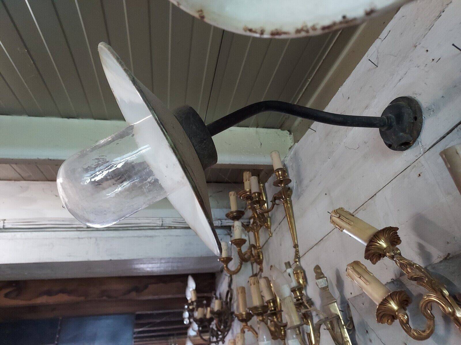 industrial wall light in the shape of a swan neck