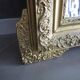 Large antique mirror in wood and gilded stucco.