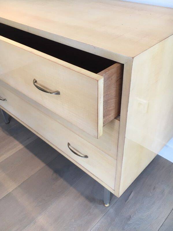 Eggshell lacquered chest of drawers with brushed steel legs. In the style of Knoll.