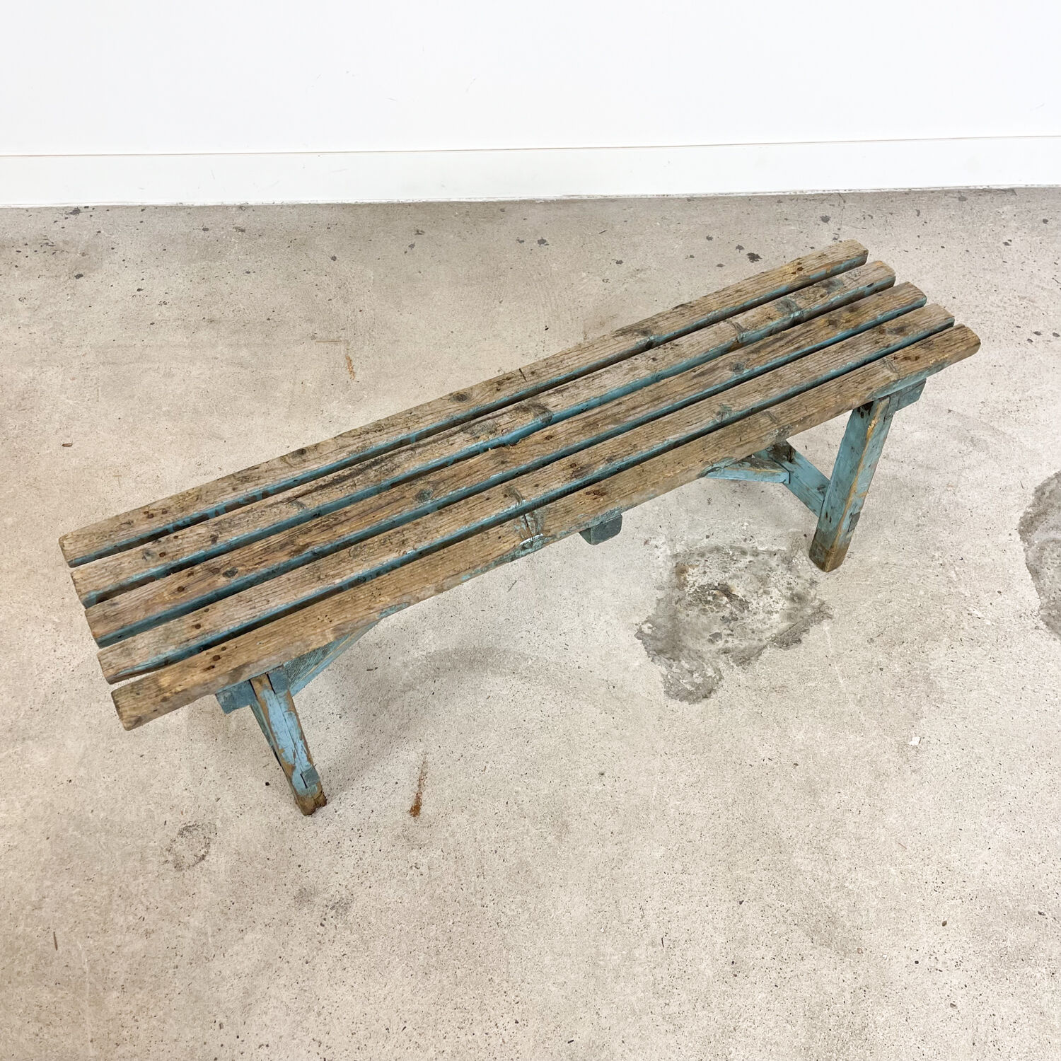 Light blue painted wooden farmhouse bench