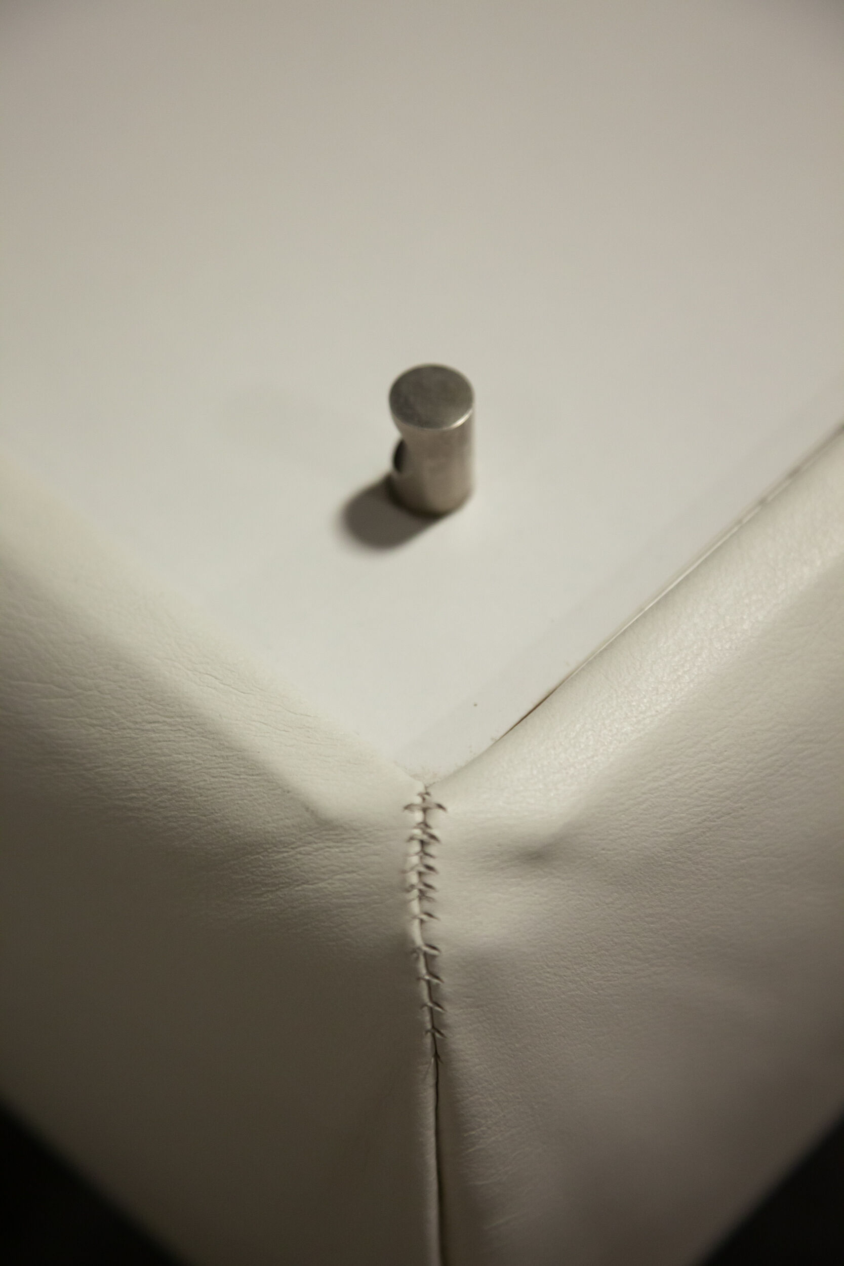Pair of 70s white leather bedsides
