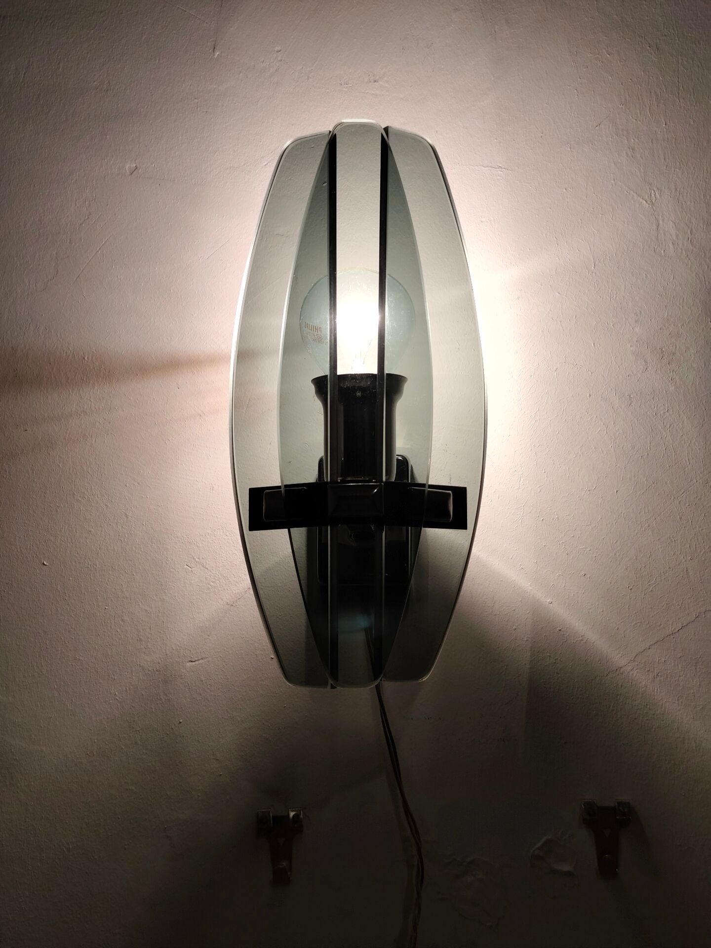 Smoked glass wall sconce. Italy, 1970s.