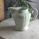 Green ceramic milk jug