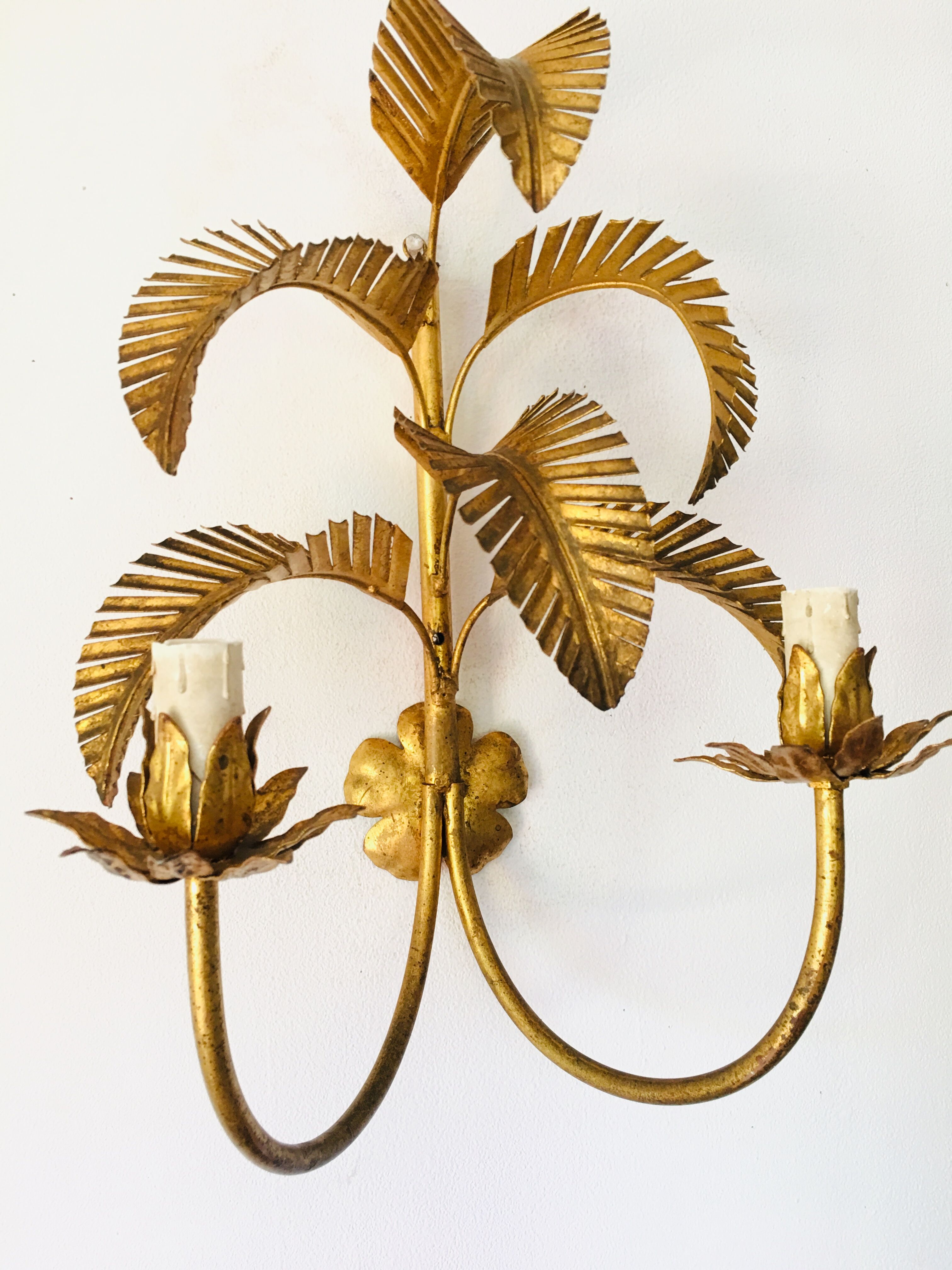 Golden palm leaf sconce