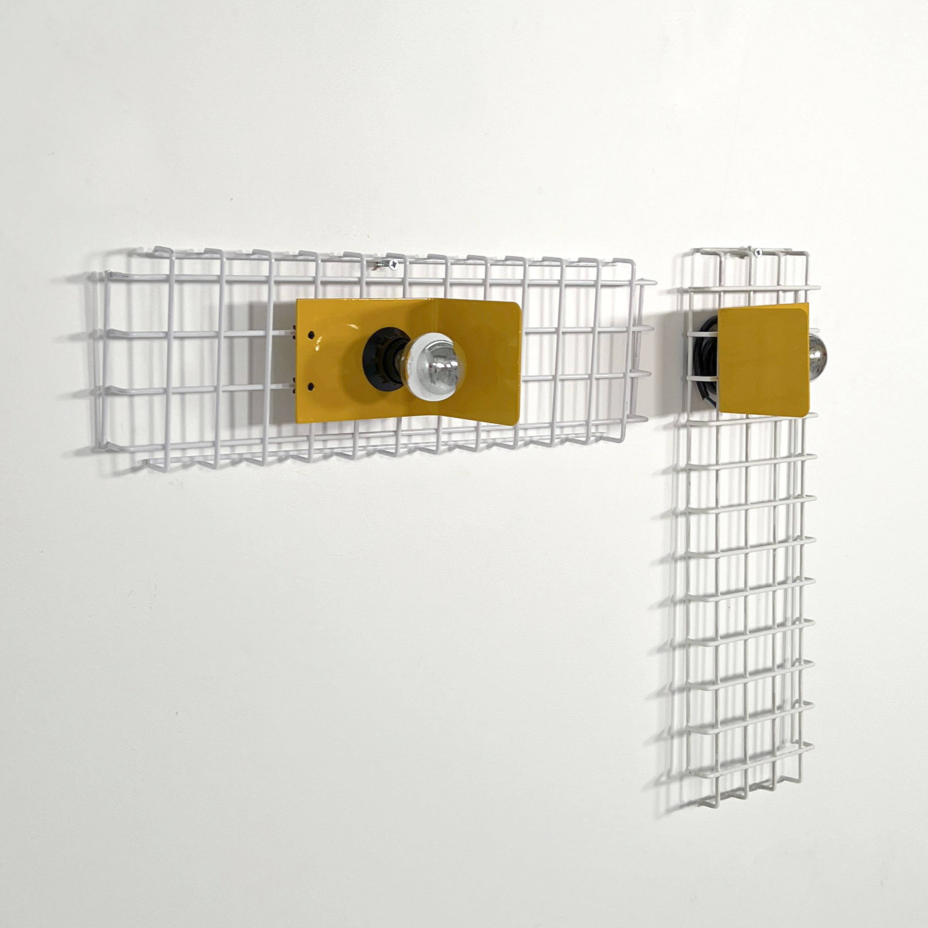 Pair of yellow wall sconces on wire mesh by Seccose, 1980