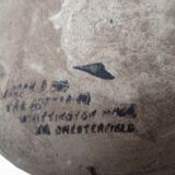 Old wiskhey jug in sand