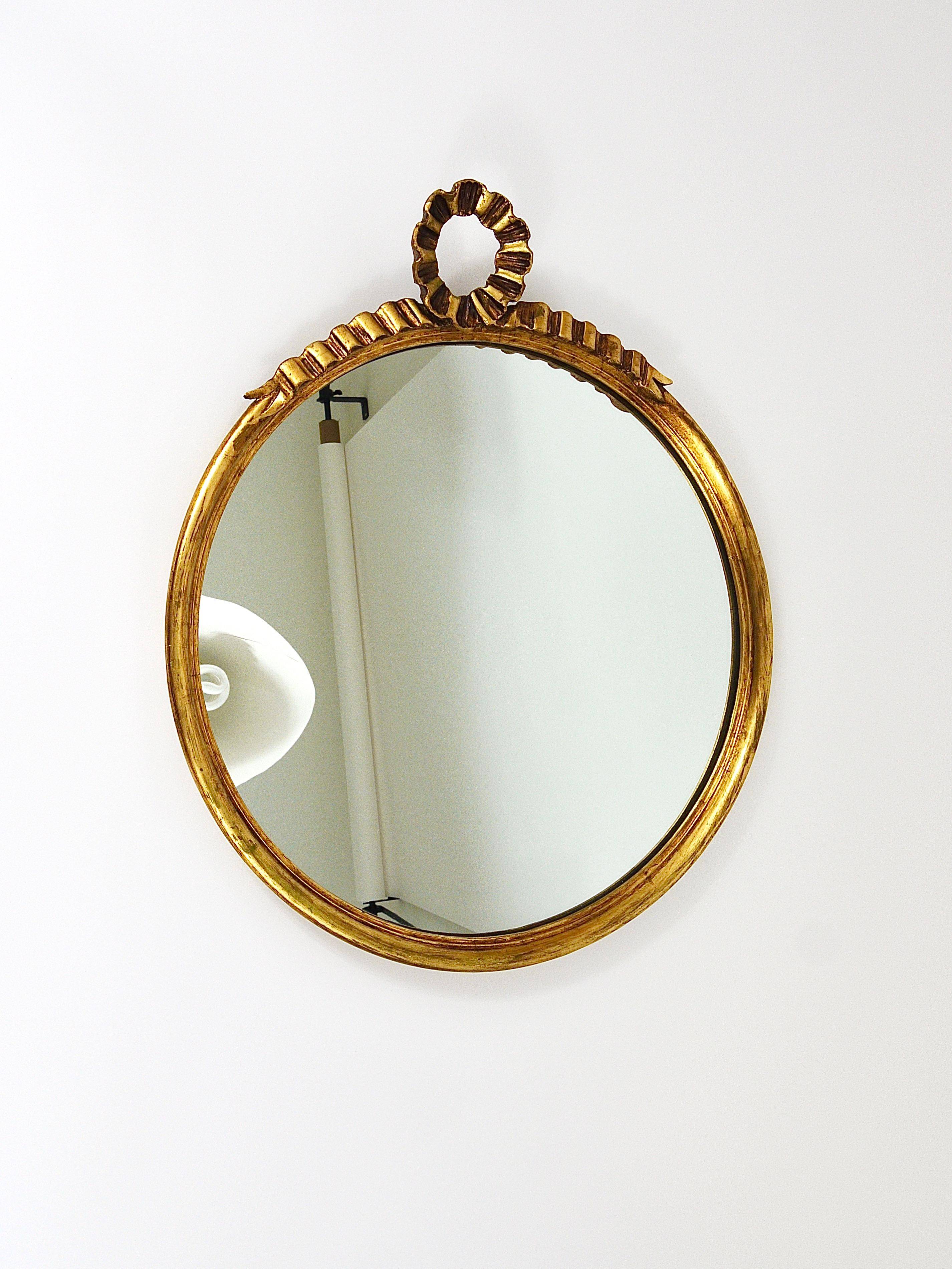 Round wall mirror in gilded wood, mid-century, C. Allodi & G. Subelli, Italy, 1950s.