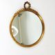 Round wall mirror in gilded wood, mid-century, C. Allodi & G. Subelli, Italy, 1950s.