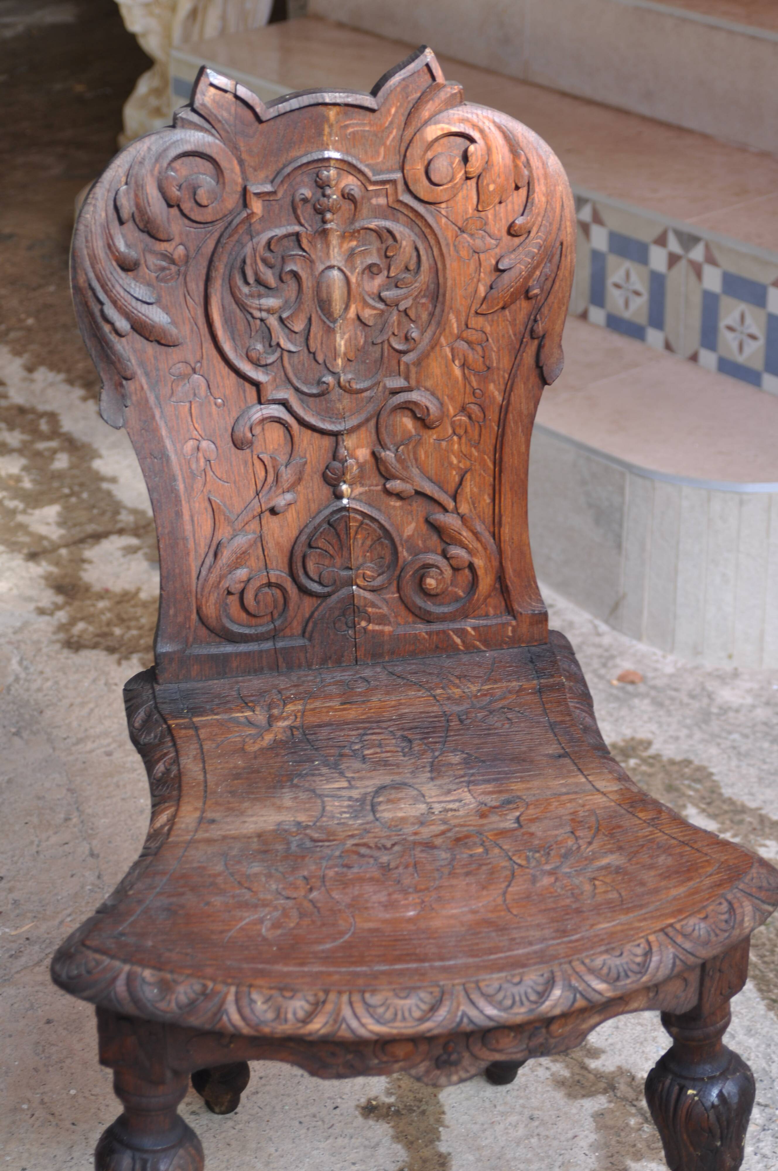 Pair of antique carved wooden chairs