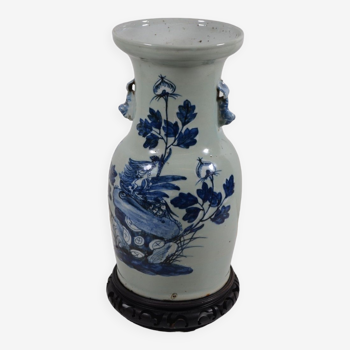 China. Porcelain mallet vase with blue and white phoenix decoration on a rock.