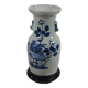 China. Porcelain mallet vase with blue and white phoenix decoration on a rock.