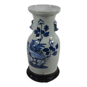 China. Porcelain mallet vase with blue and white phoenix decoration on a rock.