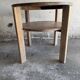 Art Deco round oak side table in light weathered oak with lower shelf, geometric three-leg design