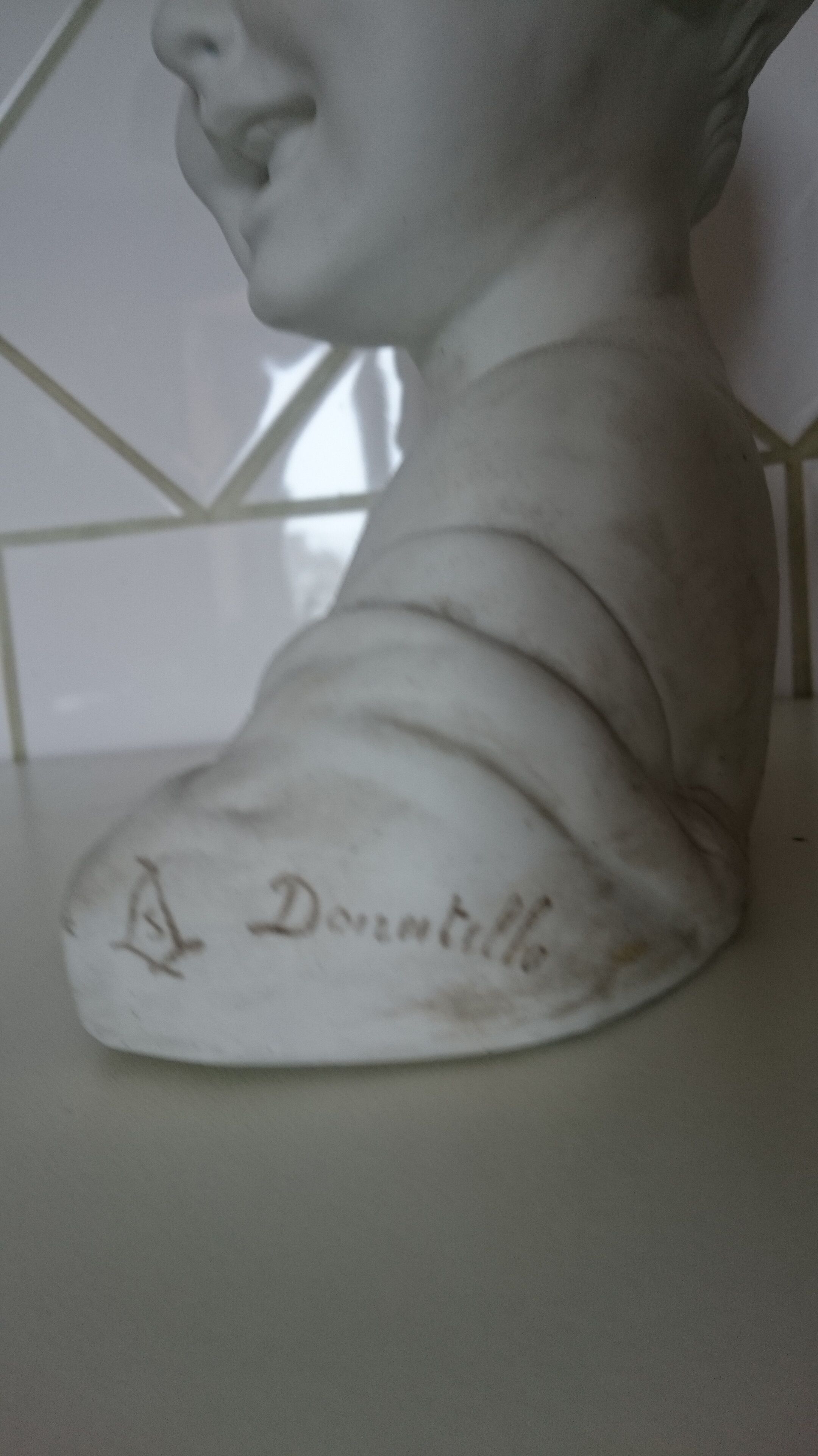 Laughing child bust after Donatello in Sèvres biscuit