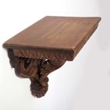 Carved wooden shelf