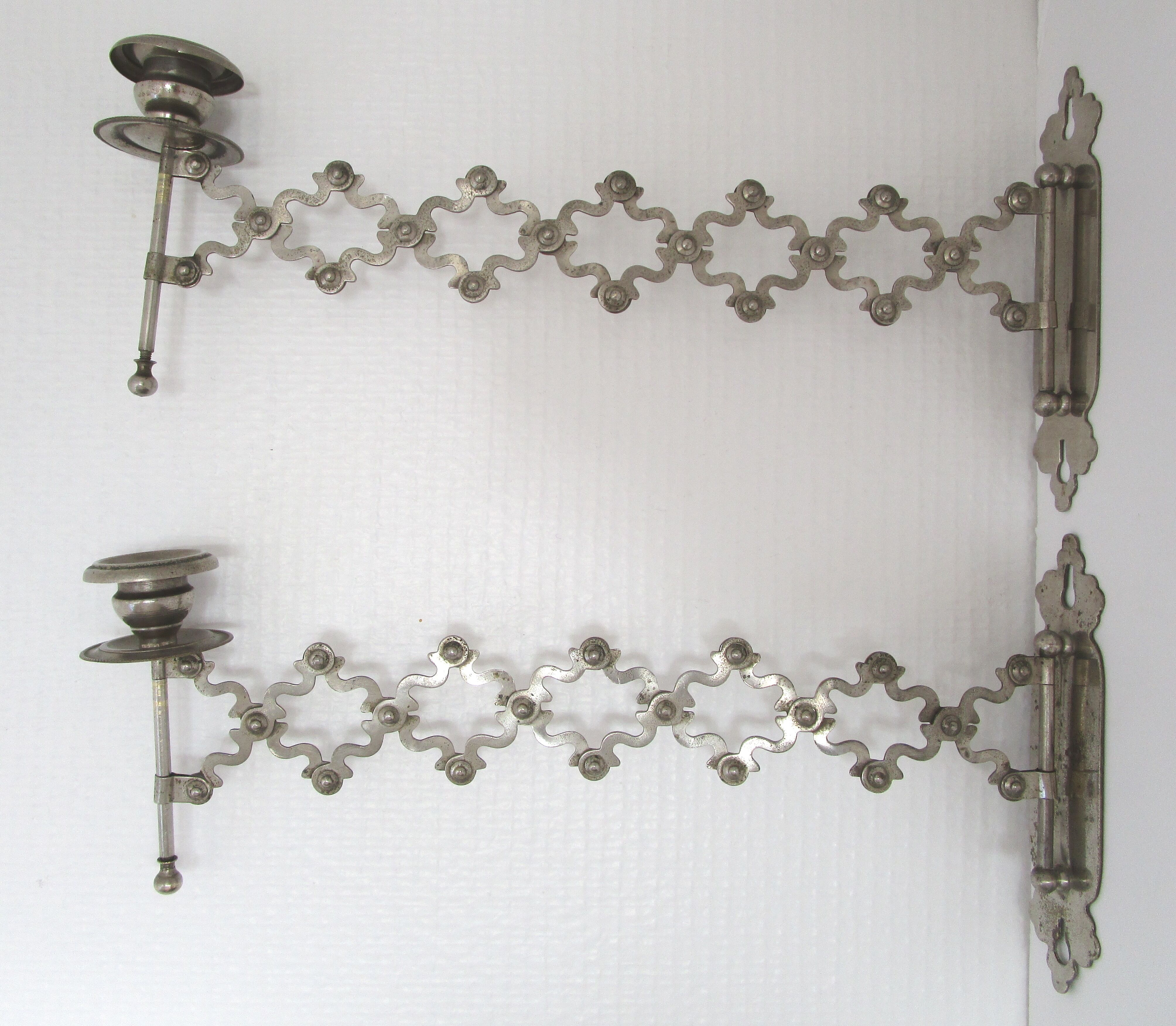 Pair of extendable old metal candlesticks