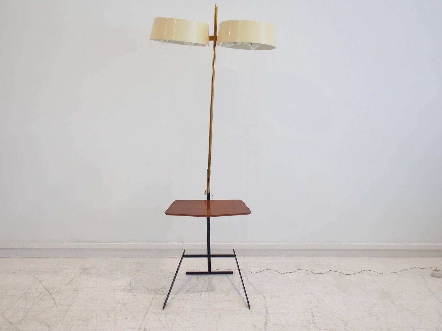Brass and lacquered metal floor lamp with a wooden magazine shelf.