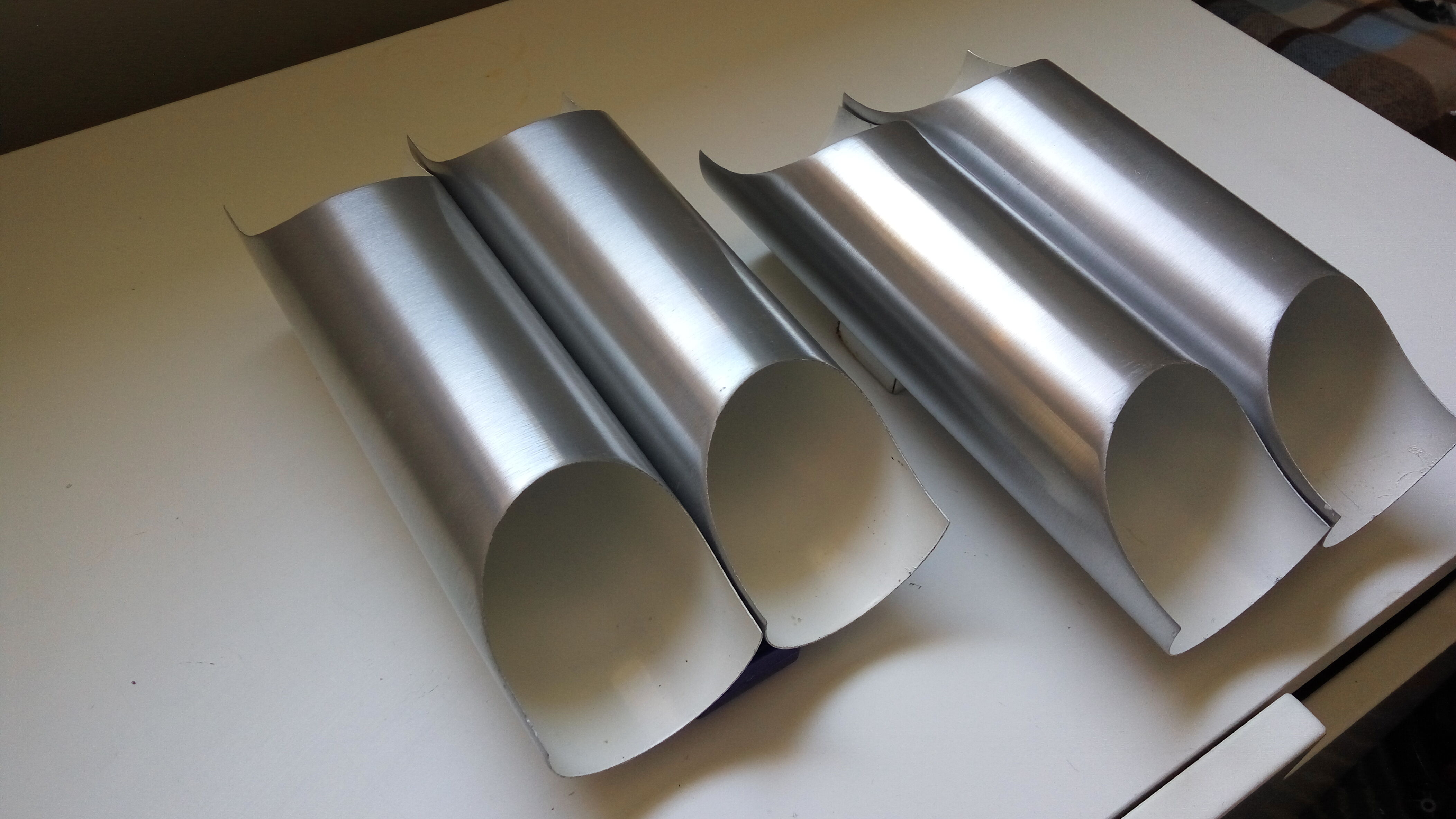 Pair of wall sconces by Fugue Raak