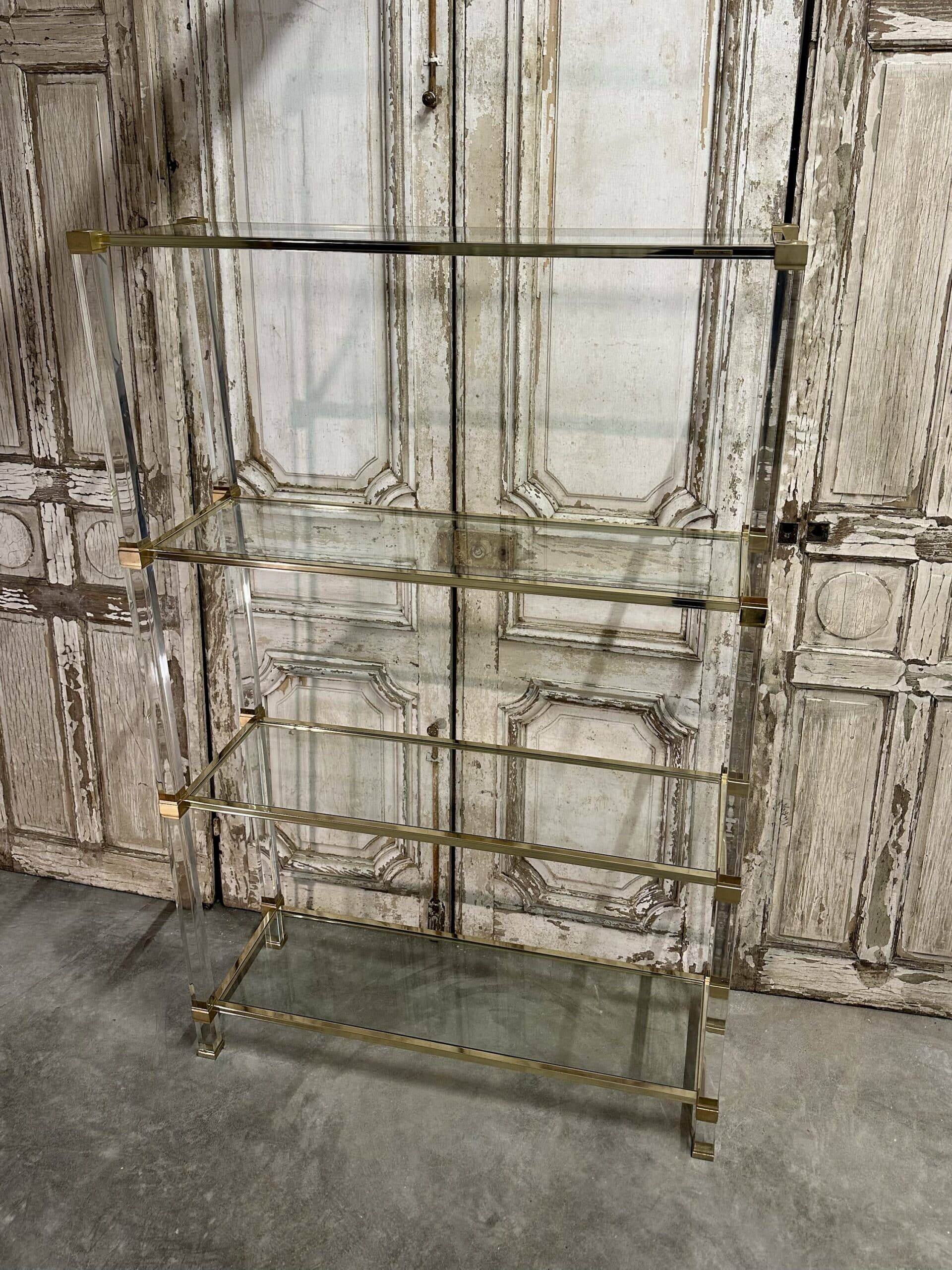 Plexiglass shelf by Pierre Vandel in Hollywood Regency style circa 1970.