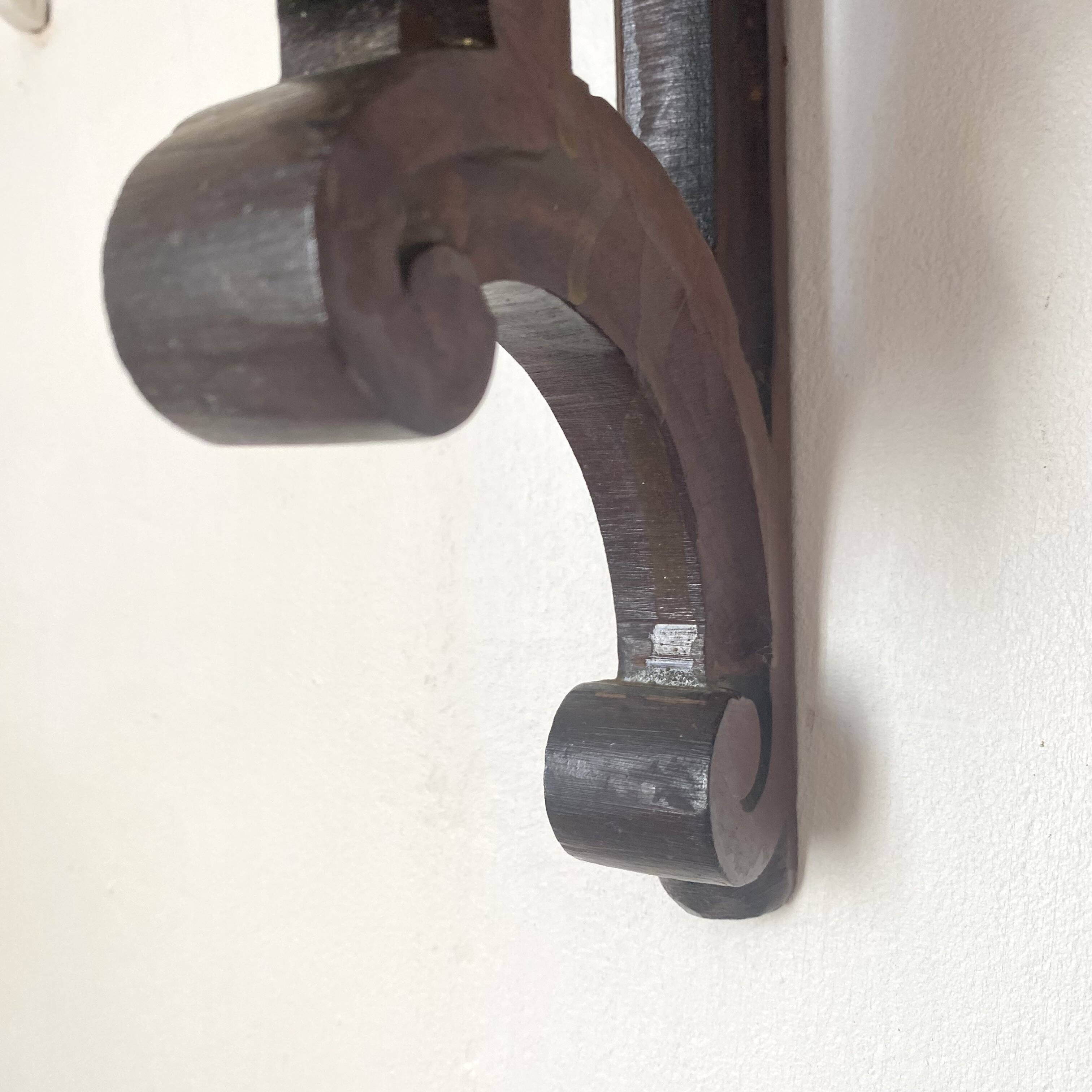 antique oak wall shelf with carved brackets